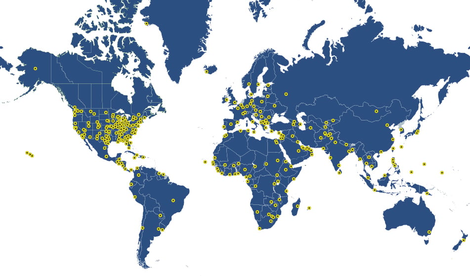 blue world map with yellow location dots