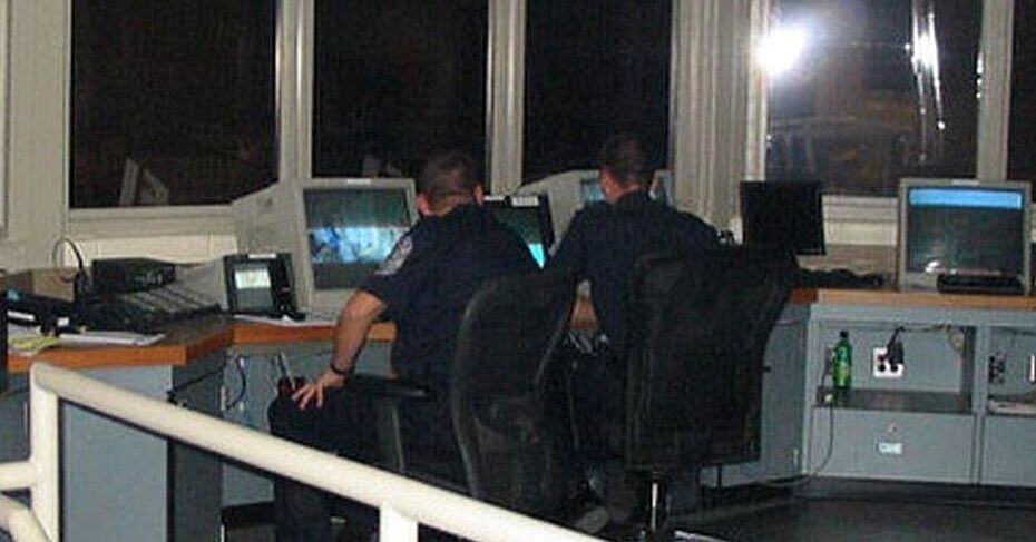 two police men looking at computer screens